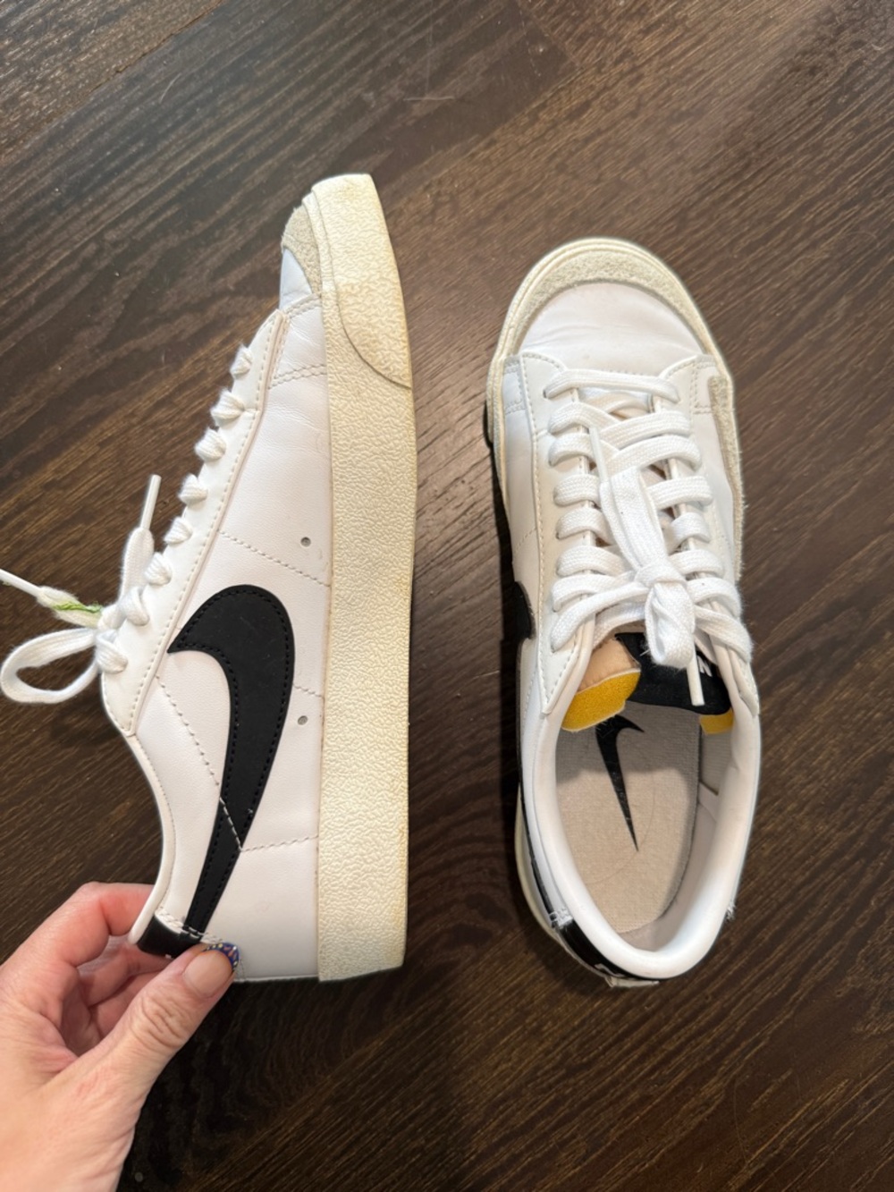 Nike White Sneakers with Black Swoosh and Yellow Tongue Accent